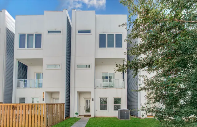 a view of a building with a yard