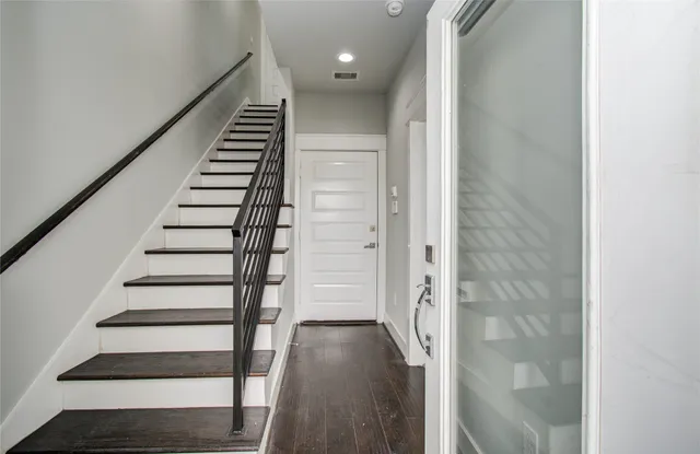 a view of entryway with wooden floor