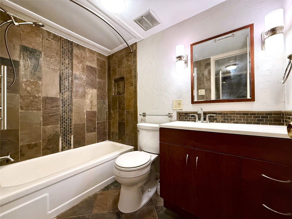606 Marshall Street, Unit B13 Houston, TX 77006 - Photo 11 of 23 a bathroom with a sink a toilet and shower