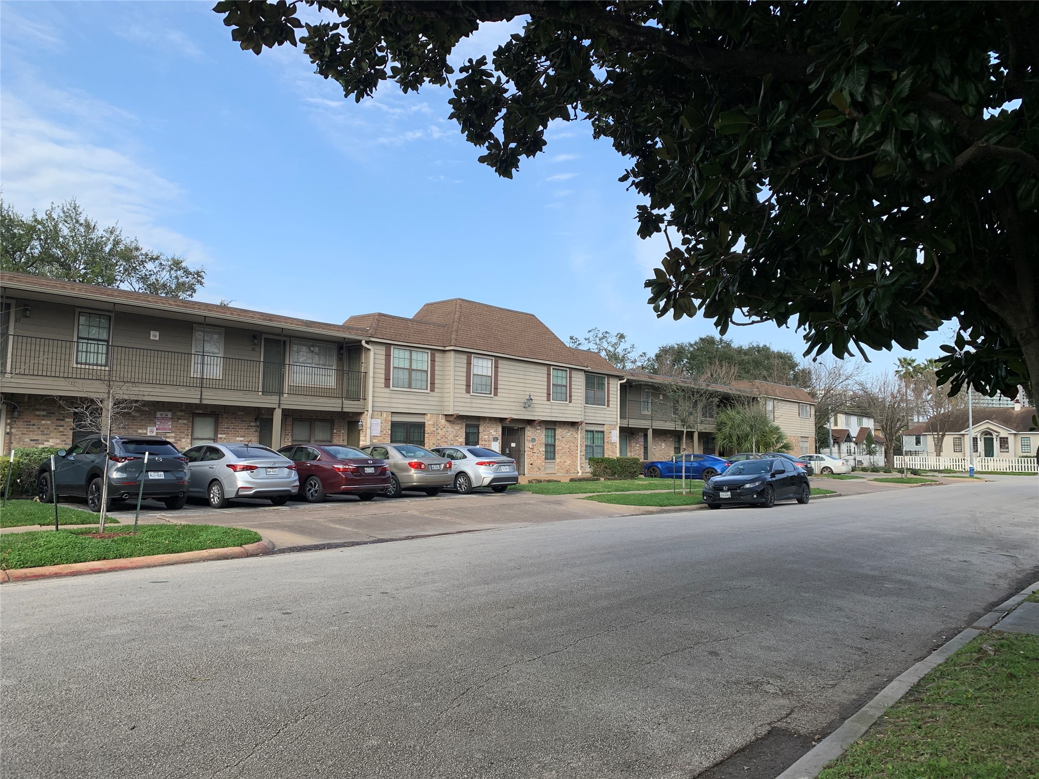 606 Marshall Street, Unit B13 Houston, TX 77006 - Photo 22 of 23 a city view with tall buildings and cars parked in front of it