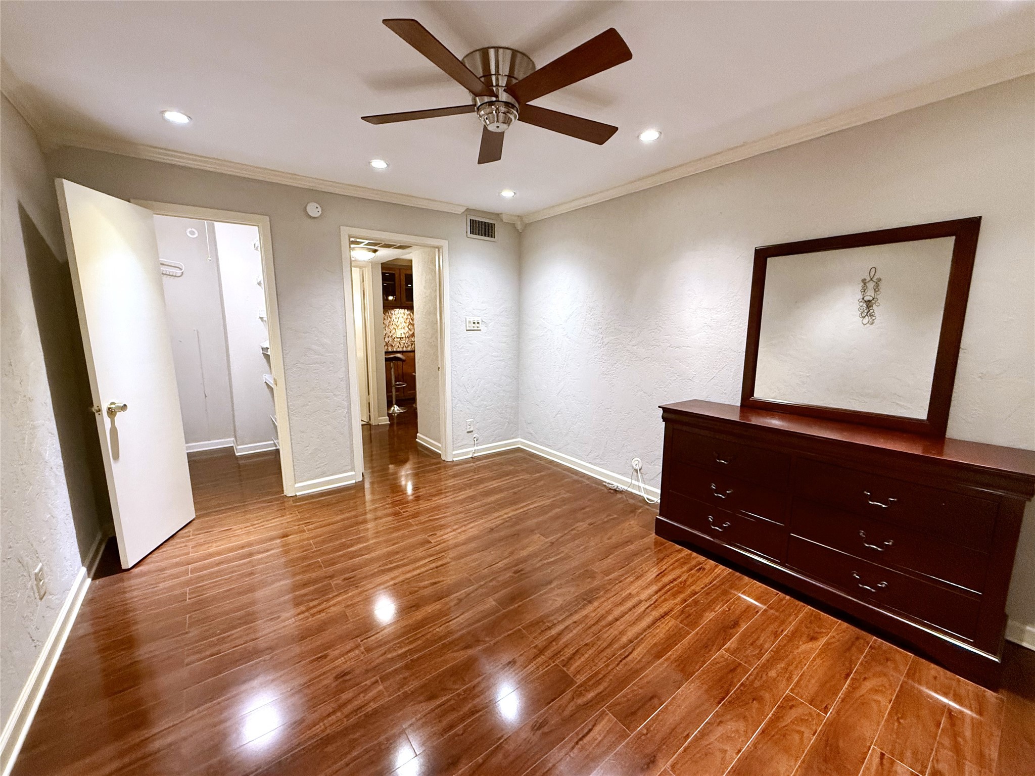 606 Marshall Street, Unit B13 Houston, TX 77006 - Photo 9 of 23 a view of an empty room and wooden floor