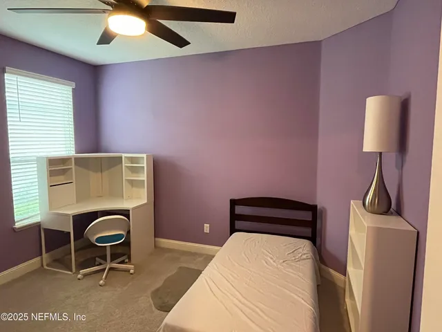 a large hall with cabinets and wooden floor