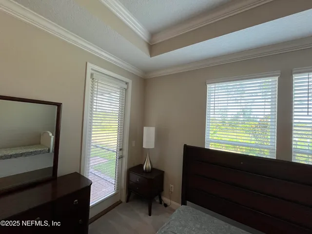 a room with a chair and a window