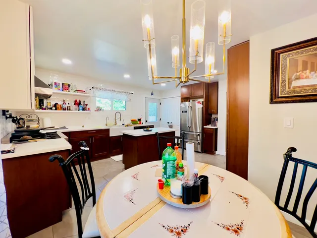 a view of kitchen dining table and chairs