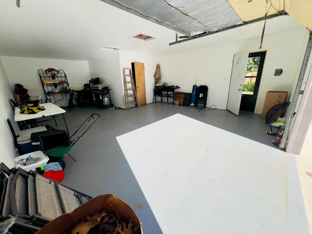 a bedroom with a bed and gym equipment