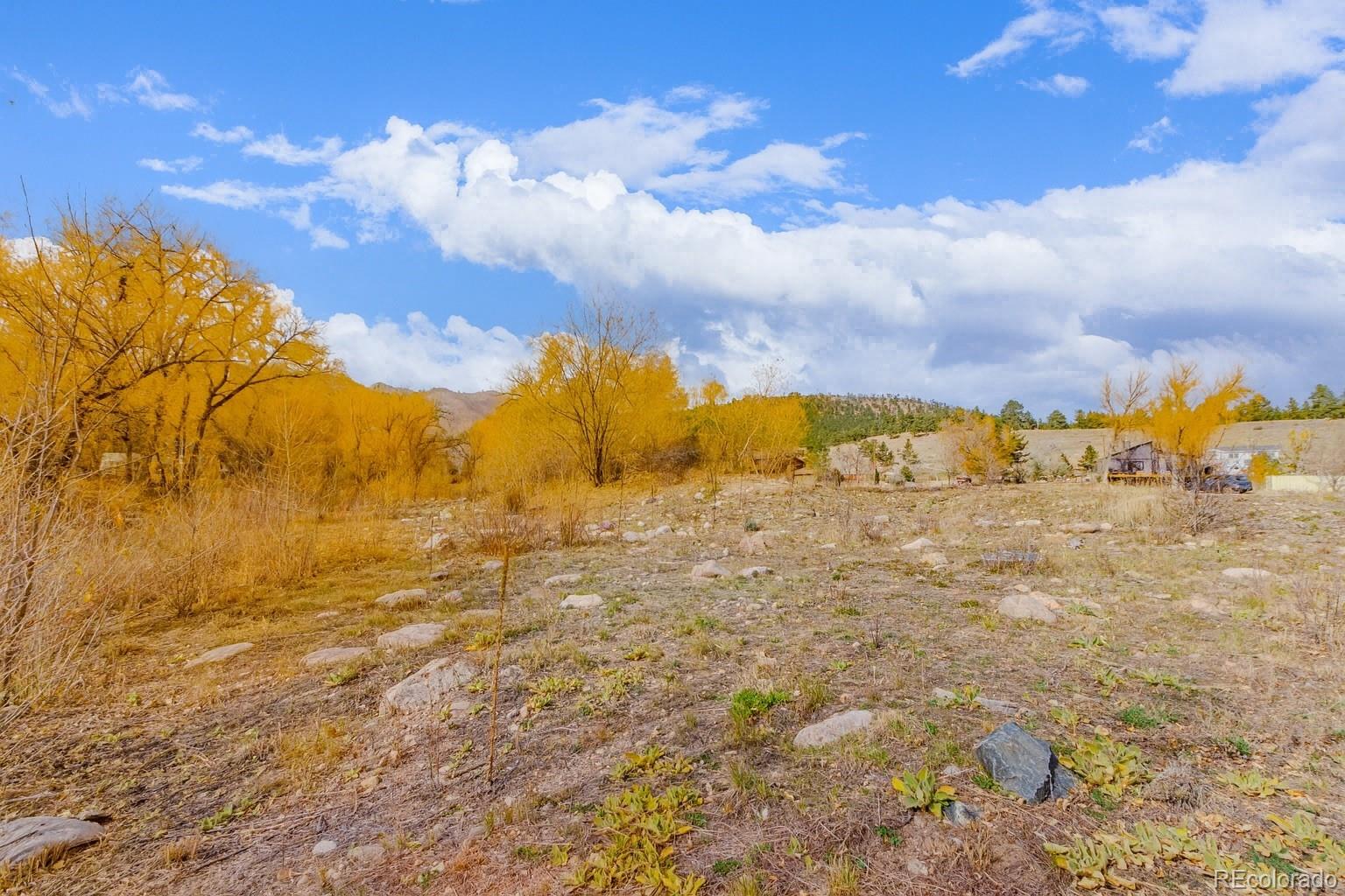 8775 Streamcrest Drive Boulder, CO 80302 - Photo 9 of 19 a view of a large yard of a of building