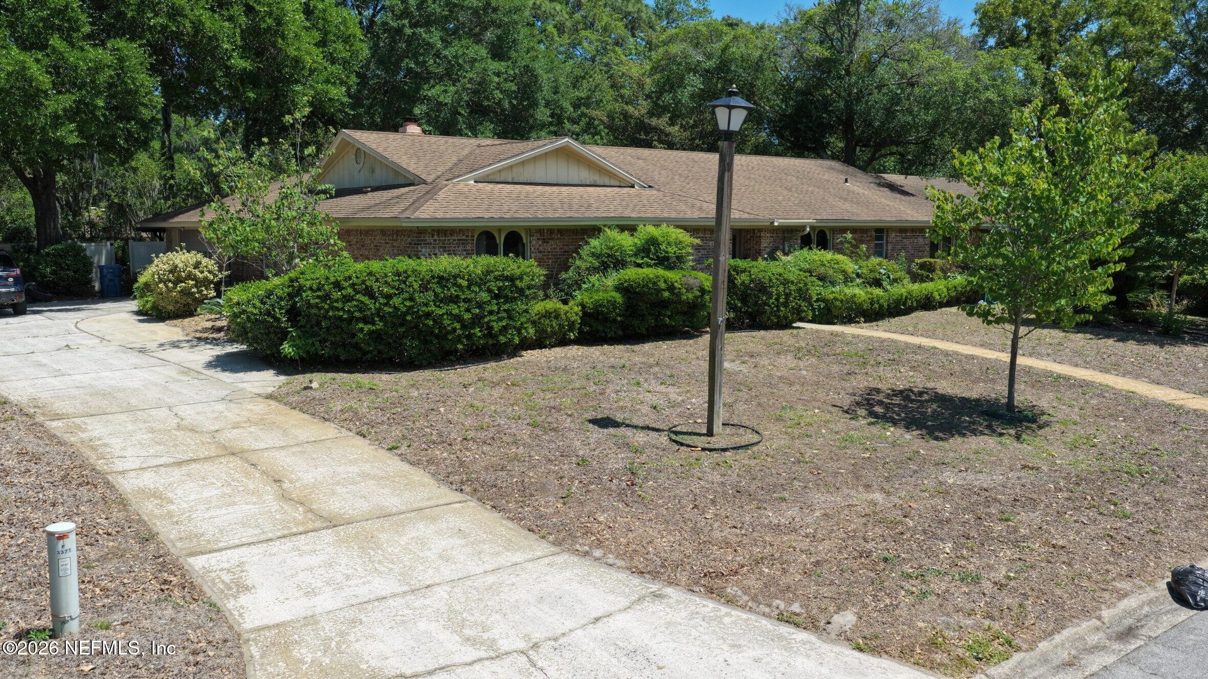 3371 Debussy Road Jacksonville, FL 32277 - Photo 2 of 21 DJI_20260423141630_0048_D