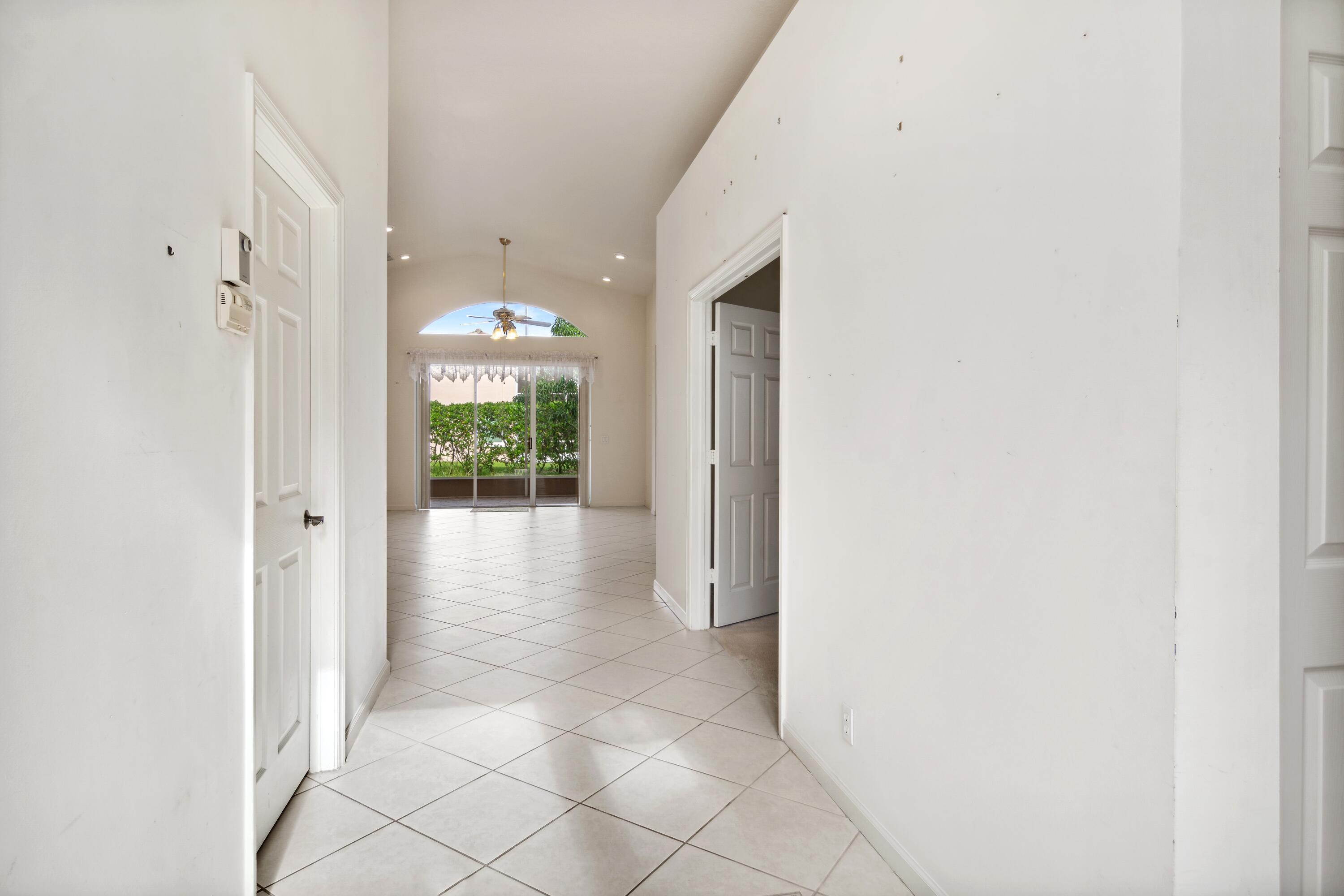 403 Springview Loop Port St. Lucie, FL 34986 - Photo 2 of 52 02_403NWSpringviewLoop_84_Entryway_HiRes