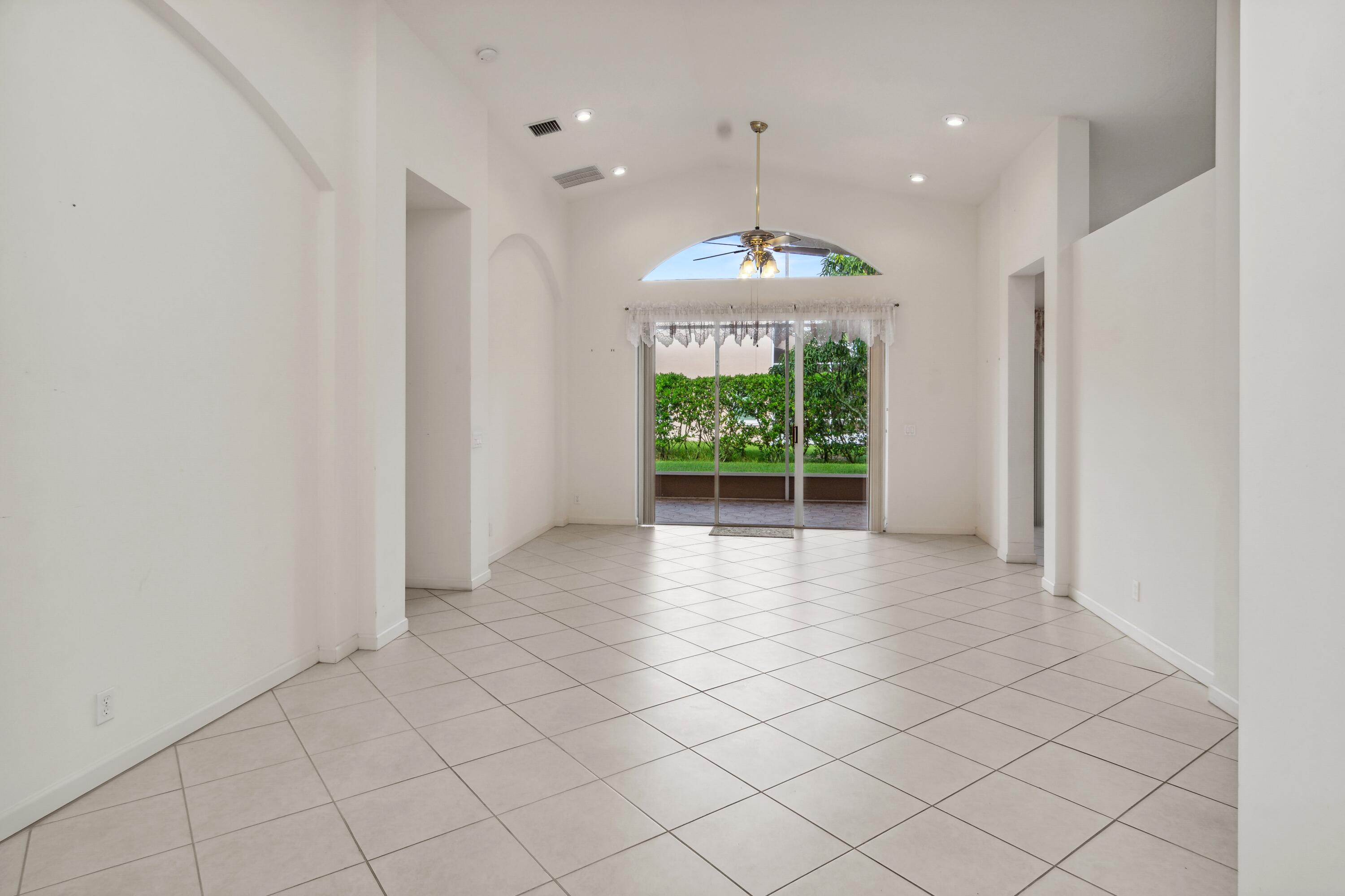 403 Springview Loop Port St. Lucie, FL 34986 - Photo 4 of 52 04_403NWSpringviewLoop_93_LivingRoomDini