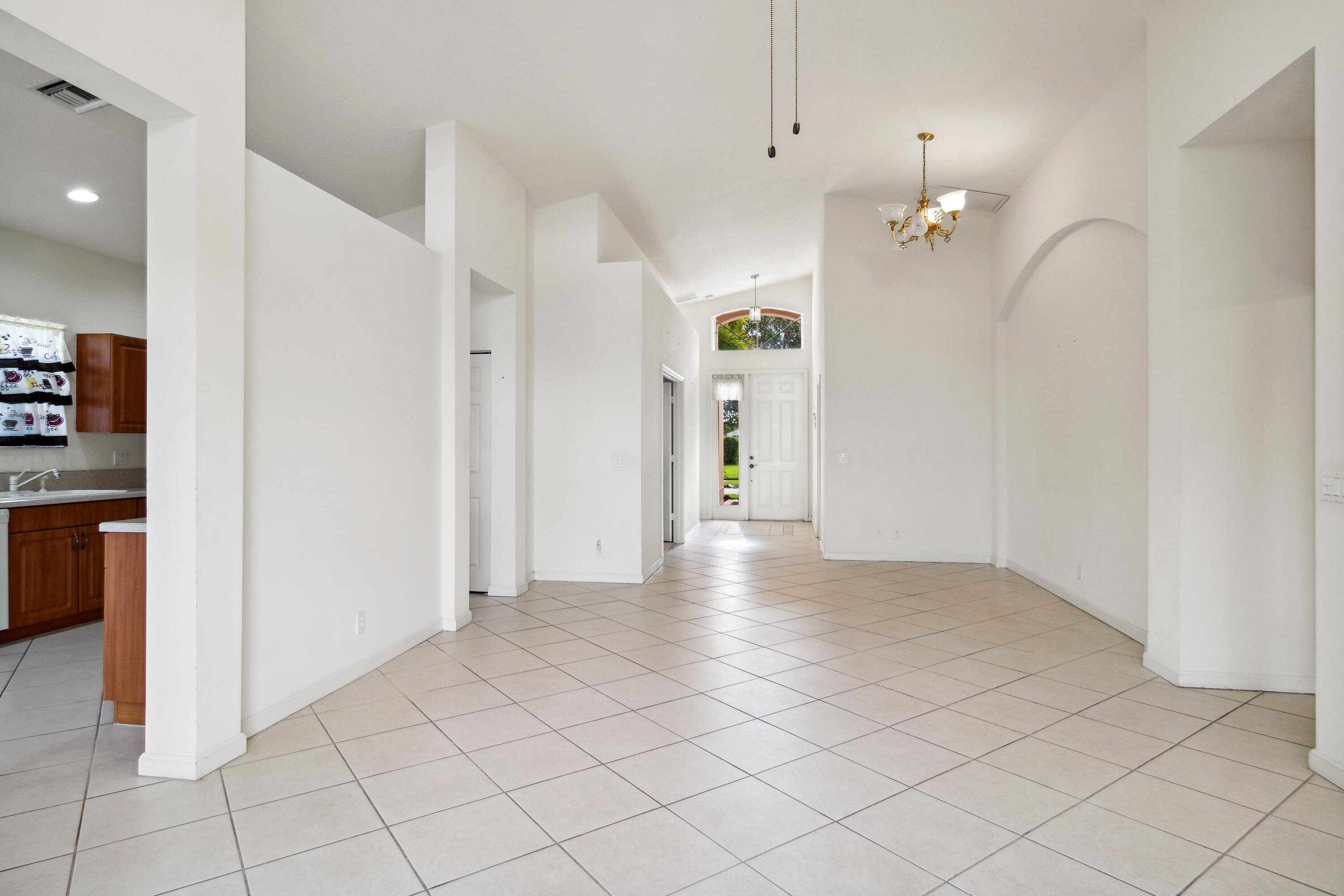 403 Springview Loop Port St. Lucie, FL 34986 - Photo 5 of 52 05_403NWSpringviewLoop_93002_LivingRoomD