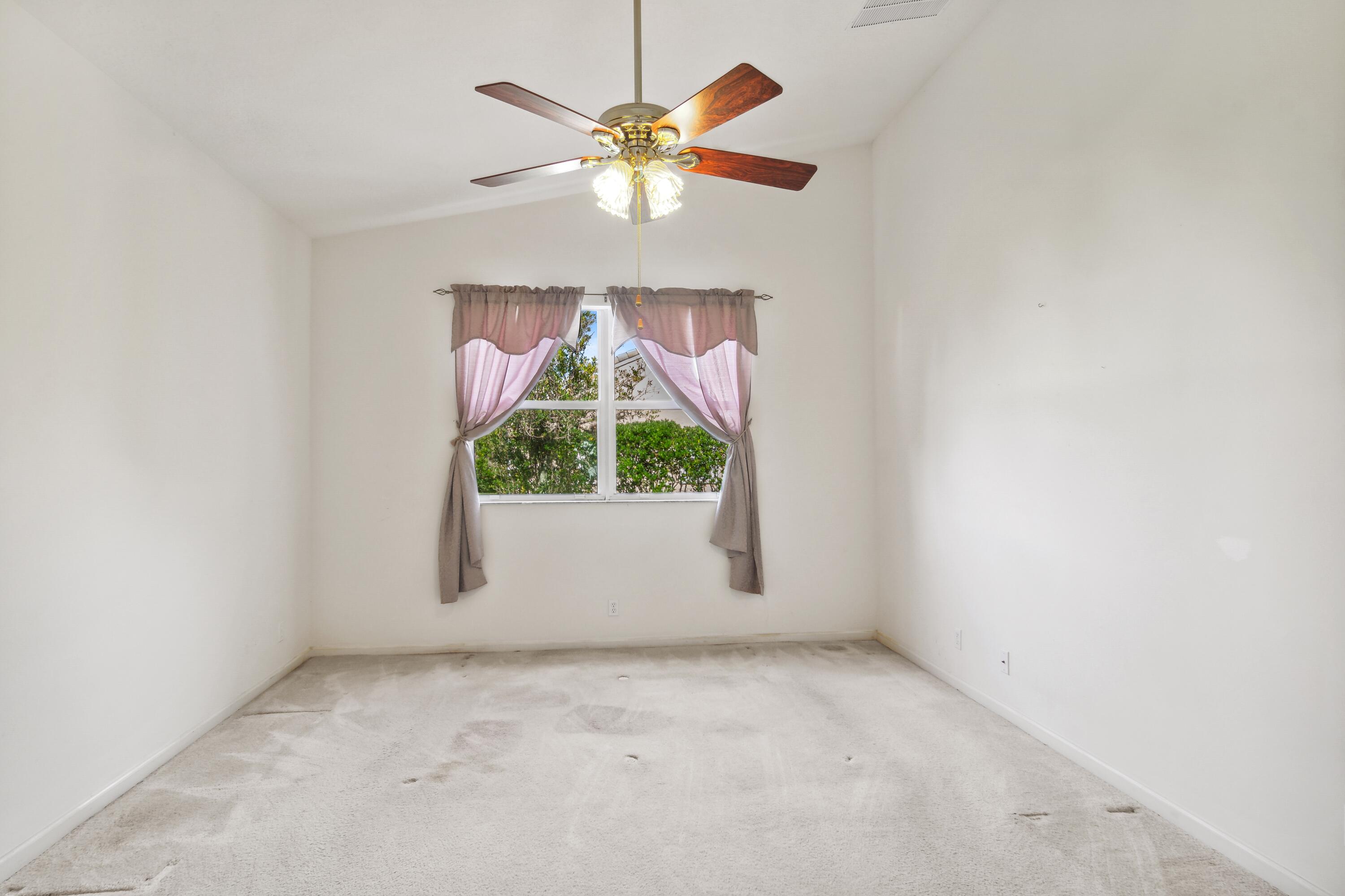 403 Springview Loop Port St. Lucie, FL 34986 - Photo 9 of 52 09_403NWSpringviewLoop_14_PrimaryBedroom