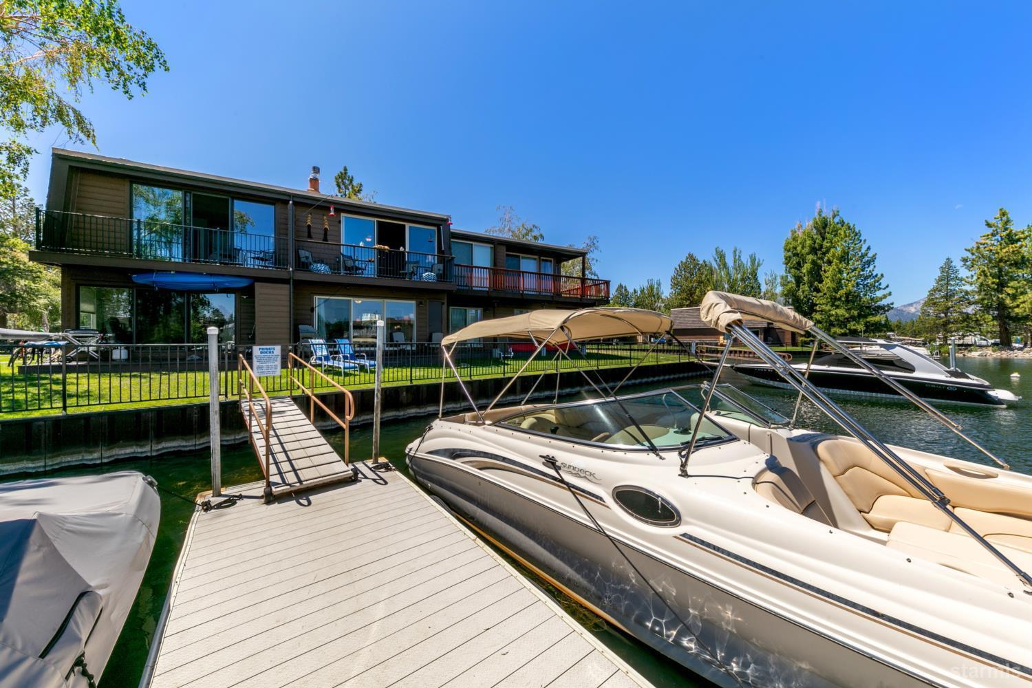 2031 Venice Drive, Unit 322 South Lake Tahoe, CA 96150 - Photo 11 of 38 a view of a house with pool and chairs