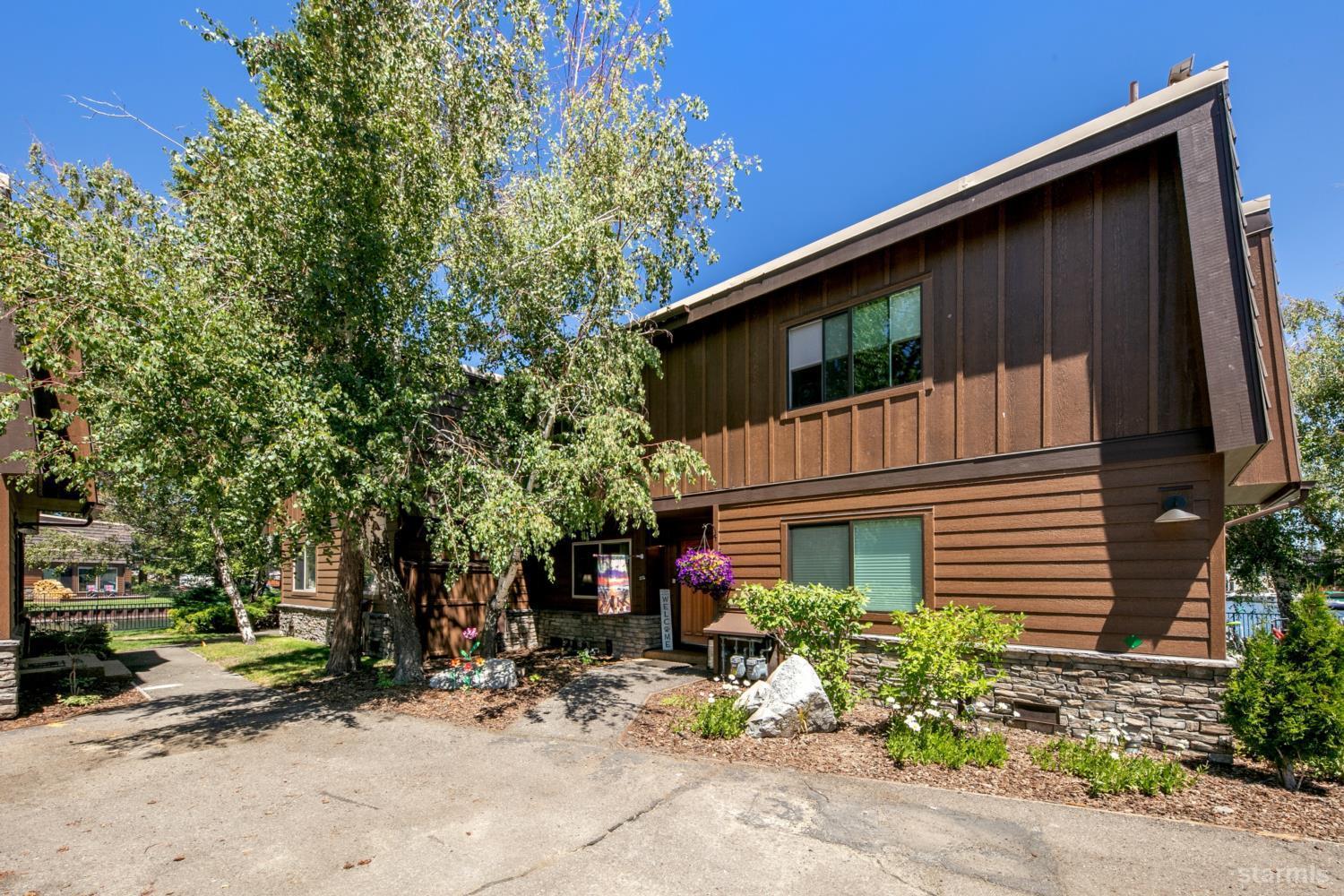 2031 Venice Drive, Unit 322 South Lake Tahoe, CA 96150 - Photo 19 of 38 a view of a house with a yard
