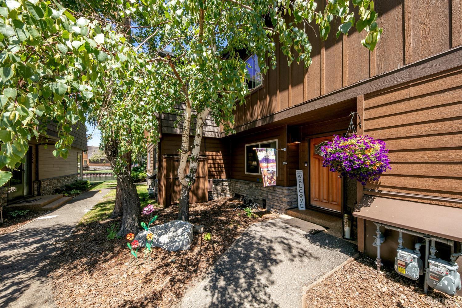 2031 Venice Drive, Unit 322 South Lake Tahoe, CA 96150 - Photo 20 of 38 a front view of a house with plants