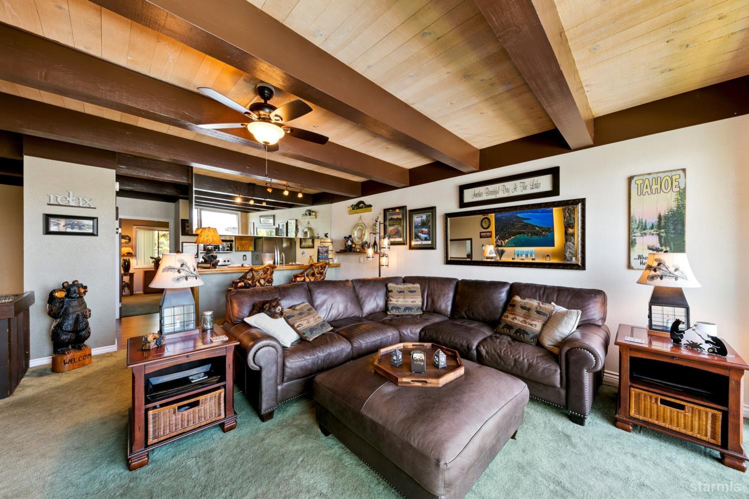 2031 Venice Drive, Unit 322 South Lake Tahoe, CA 96150 - Photo 23 of 38 a living room with furniture and a flat screen tv