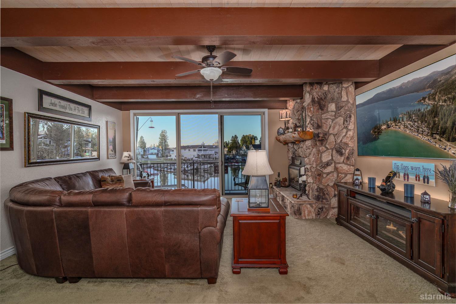 2031 Venice Drive, Unit 322 South Lake Tahoe, CA 96150 - Photo 25 of 38 a living room with furniture and a large window