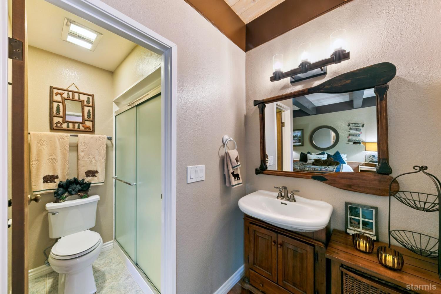 2031 Venice Drive, Unit 322 South Lake Tahoe, CA 96150 - Photo 32 of 38 a bathroom with a sink a toilet and shower