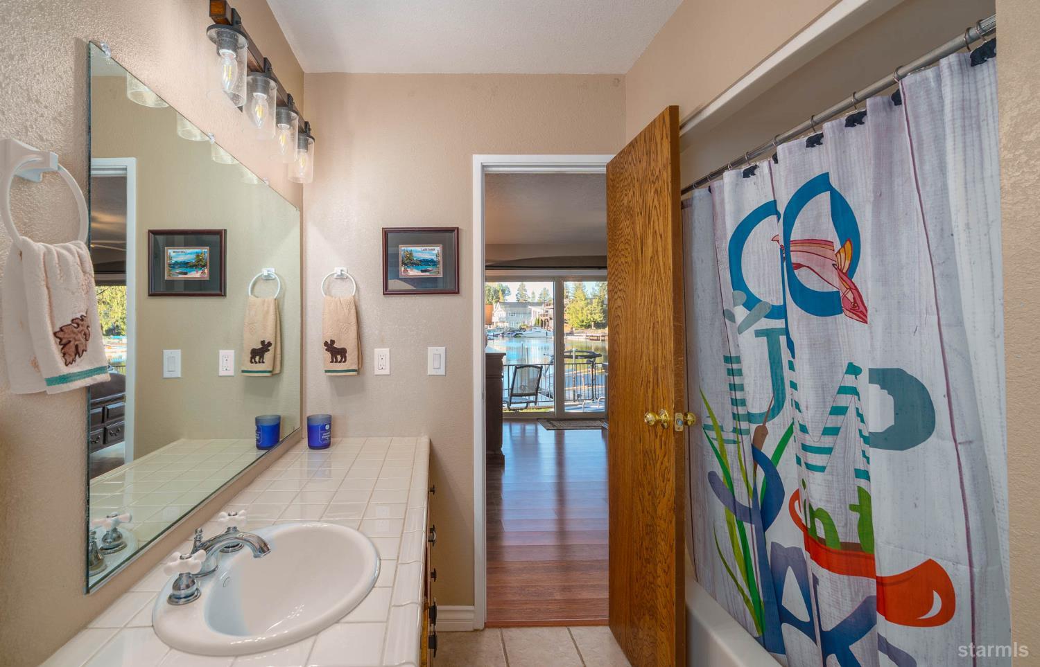 2031 Venice Drive, Unit 322 South Lake Tahoe, CA 96150 - Photo 36 of 38 a bathroom with bathtub and a shower