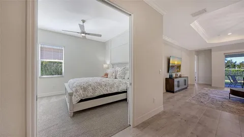 a bedroom with a bed and a mirror