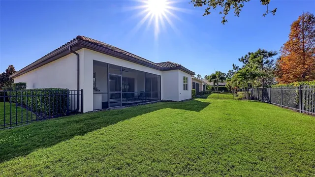 a view of a backyard with pathway