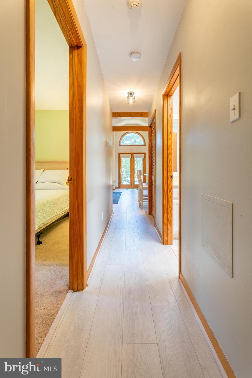 122 Nottingham Lane Ocean Pines, MD 21811 - Photo 13 of 45 a view of hallway with livingroom and wooden floor