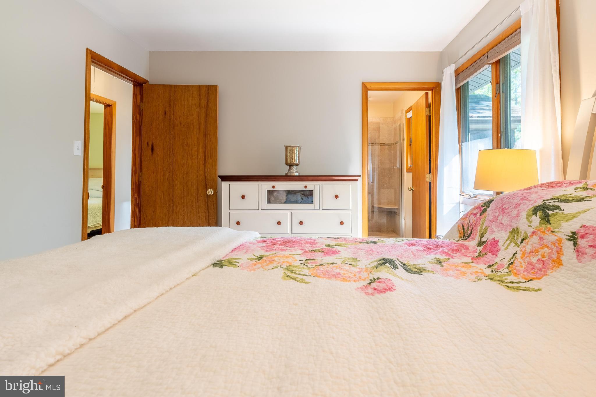 122 Nottingham Lane Ocean Pines, MD 21811 - Photo 16 of 45 a bedroom with a bed and a window