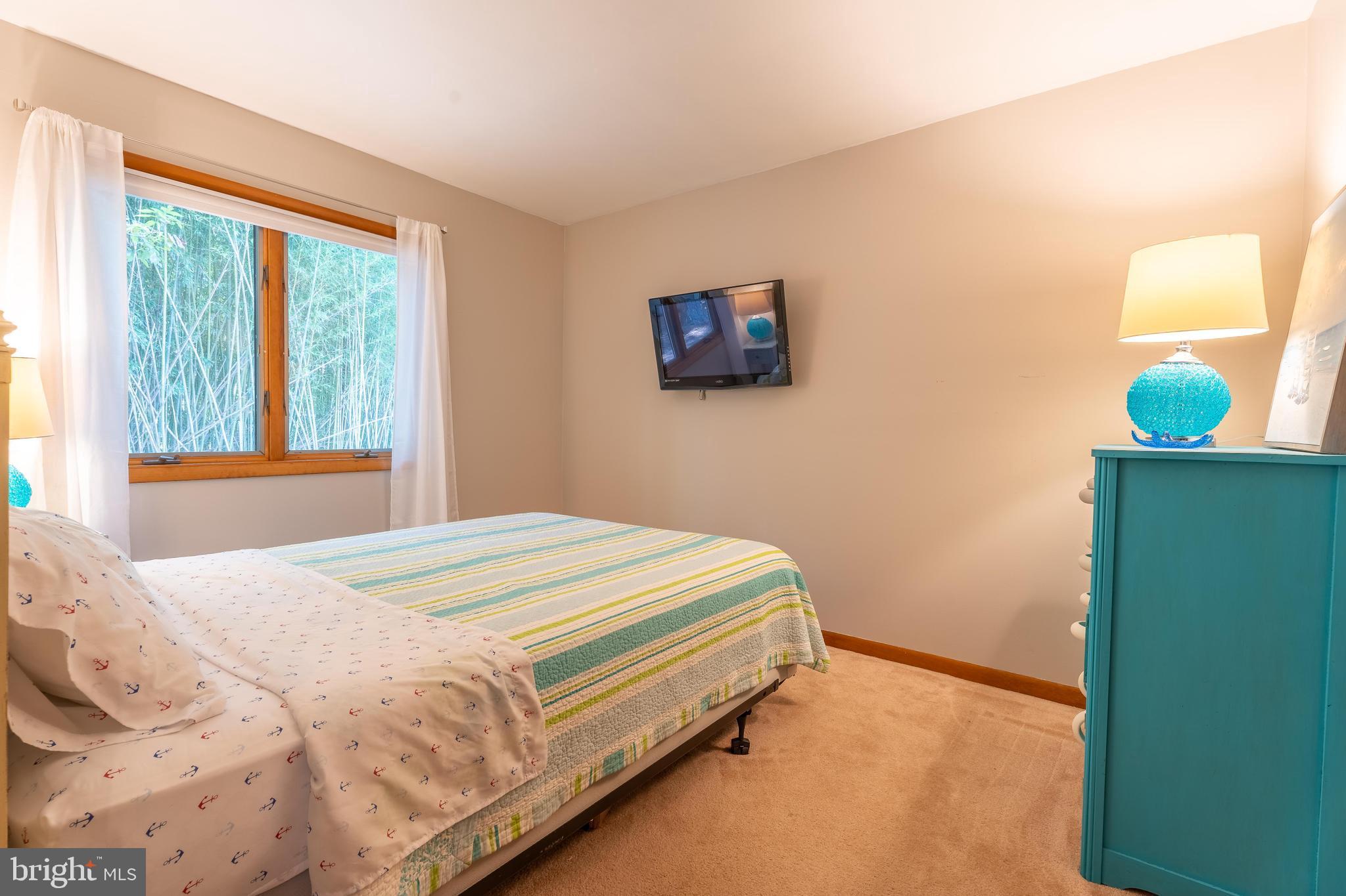 122 Nottingham Lane Ocean Pines, MD 21811 - Photo 22 of 45 a bedroom with a bed and a window