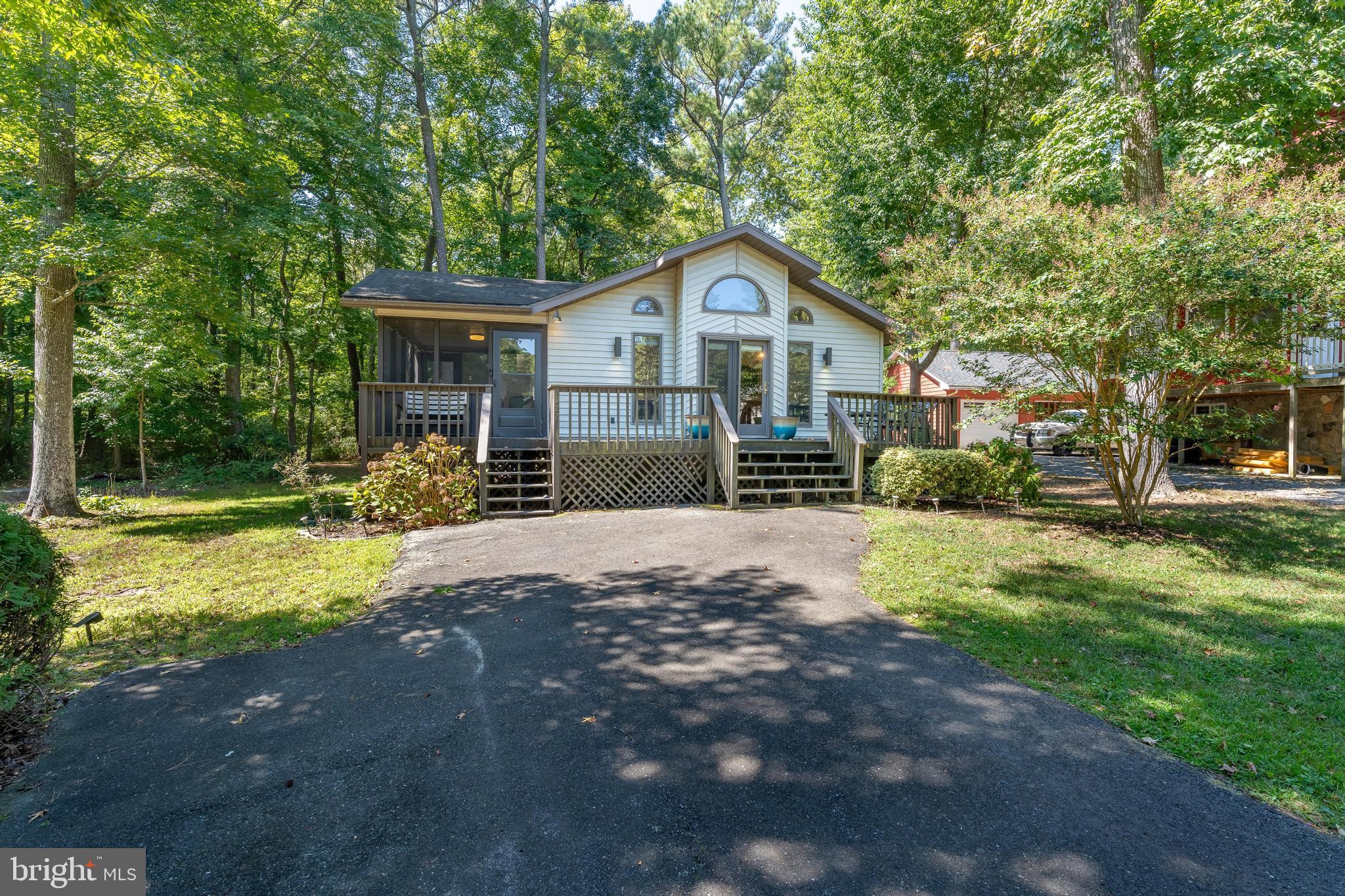 122 Nottingham Lane Ocean Pines, MD 21811 - Photo 32 of 45 a front view of a house with a yard and garage