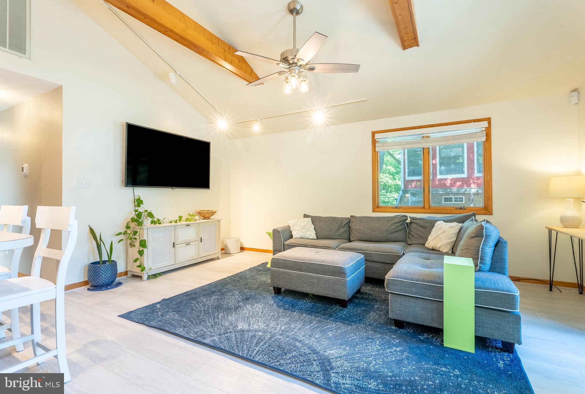122 Nottingham Lane Ocean Pines, MD 21811 - Photo 5 of 45 a living room with furniture and a flat screen tv
