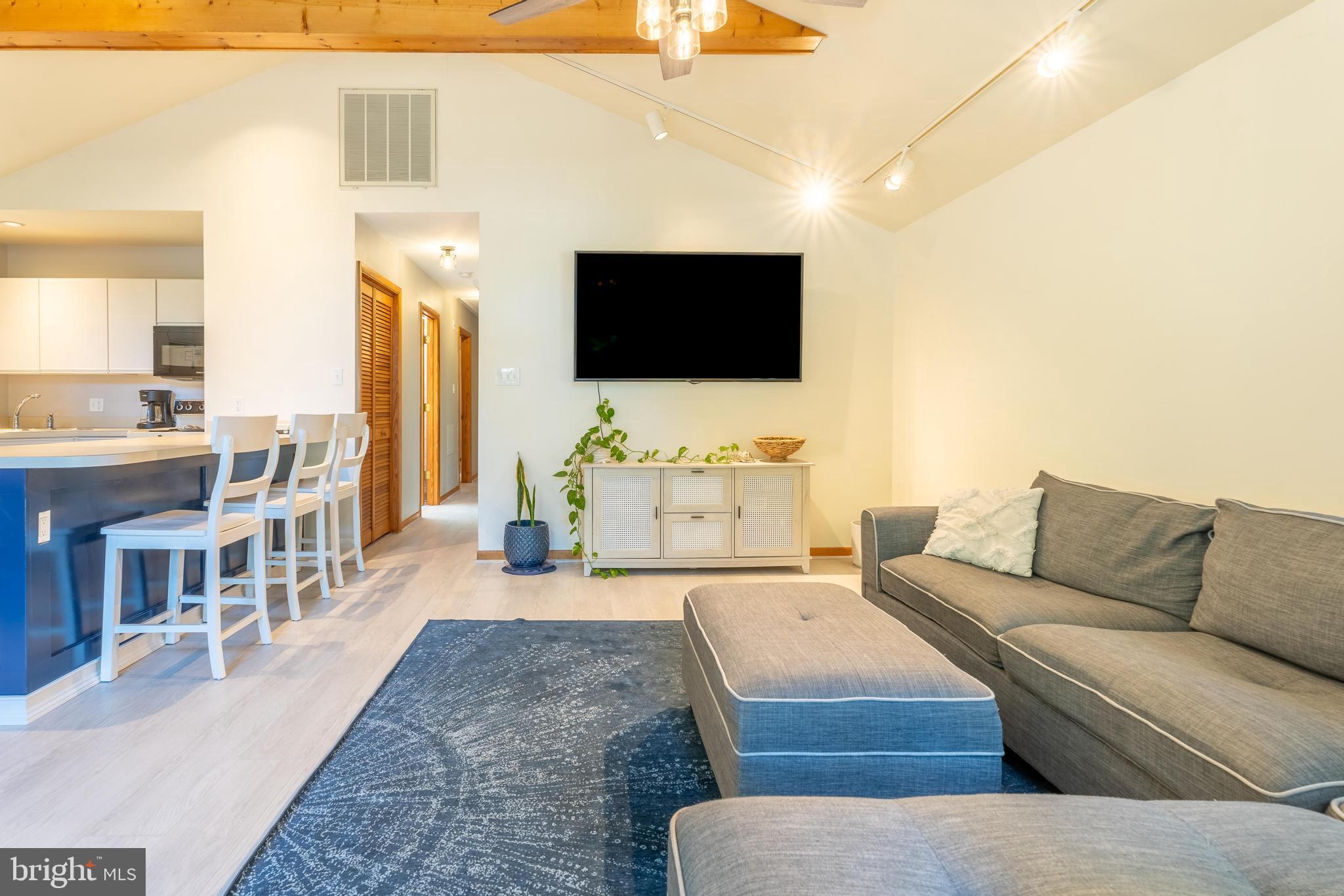 122 Nottingham Lane Ocean Pines, MD 21811 - Photo 7 of 45 a living room with furniture and a flat screen tv