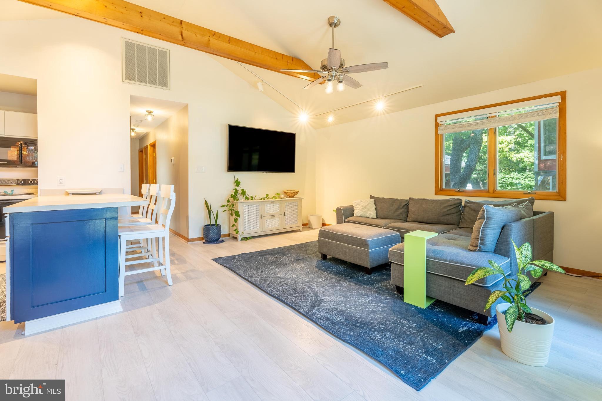 122 Nottingham Lane Ocean Pines, MD 21811 - Photo 8 of 45 a living room with furniture and a flat screen tv