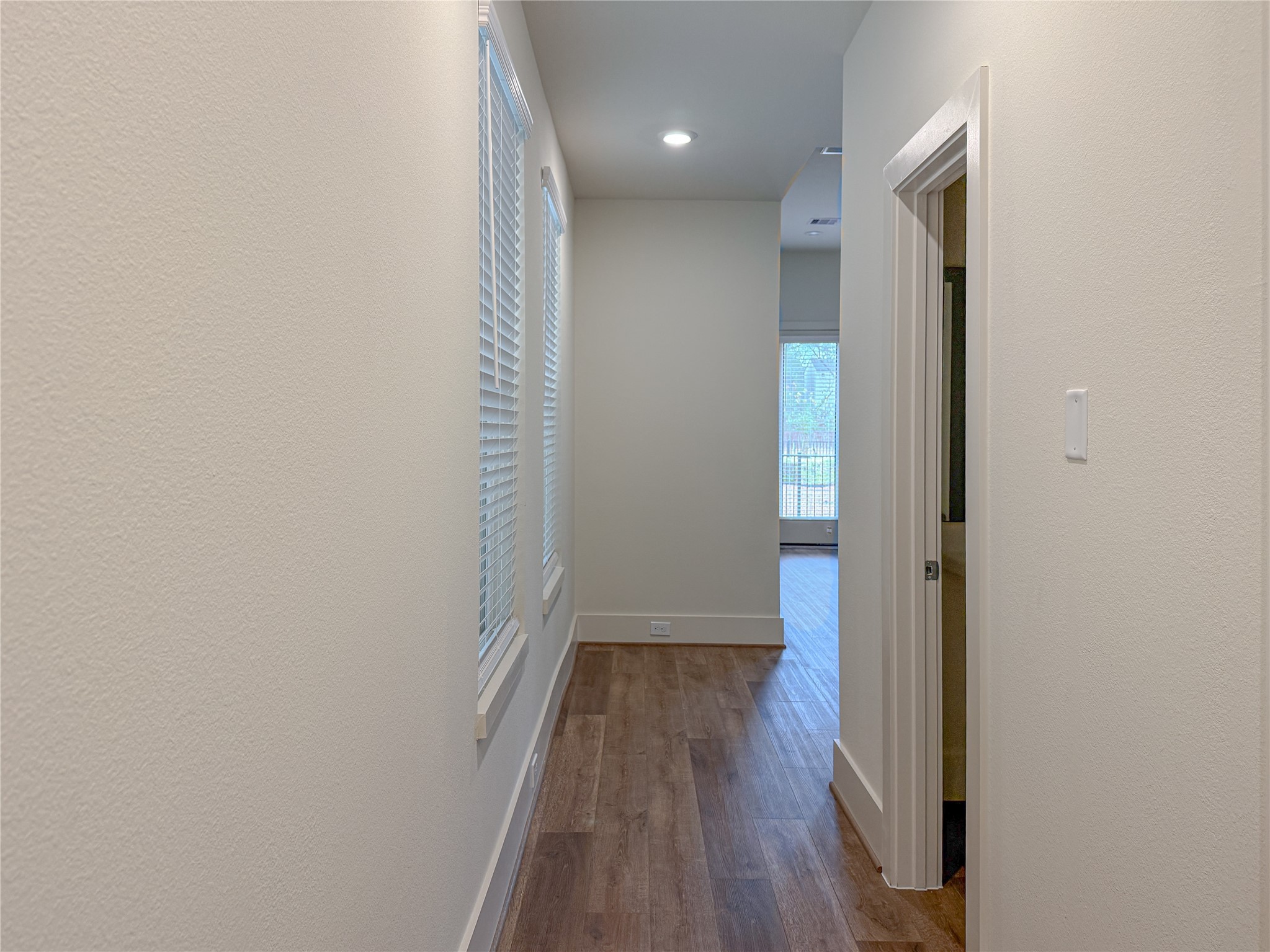 879 Rachel Street, Unit D Houston, TX 77091 - Photo 11 of 29 a view of a hallway with wooden floor