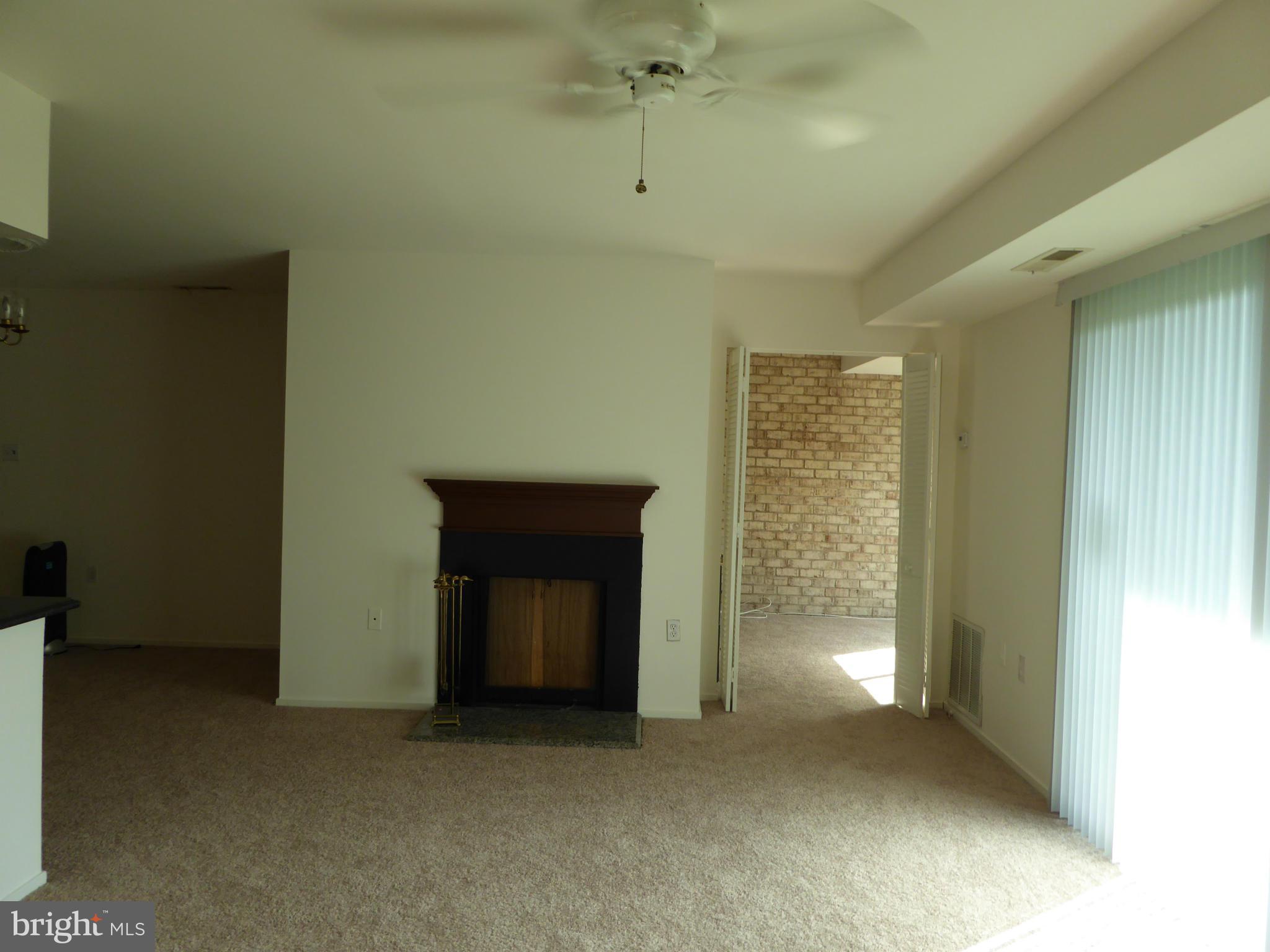 10024 Stedwick Road, Unit 202 Gaithersburg, MD 20886 - Photo 7 of 21 Living Room looking toward Fire Place