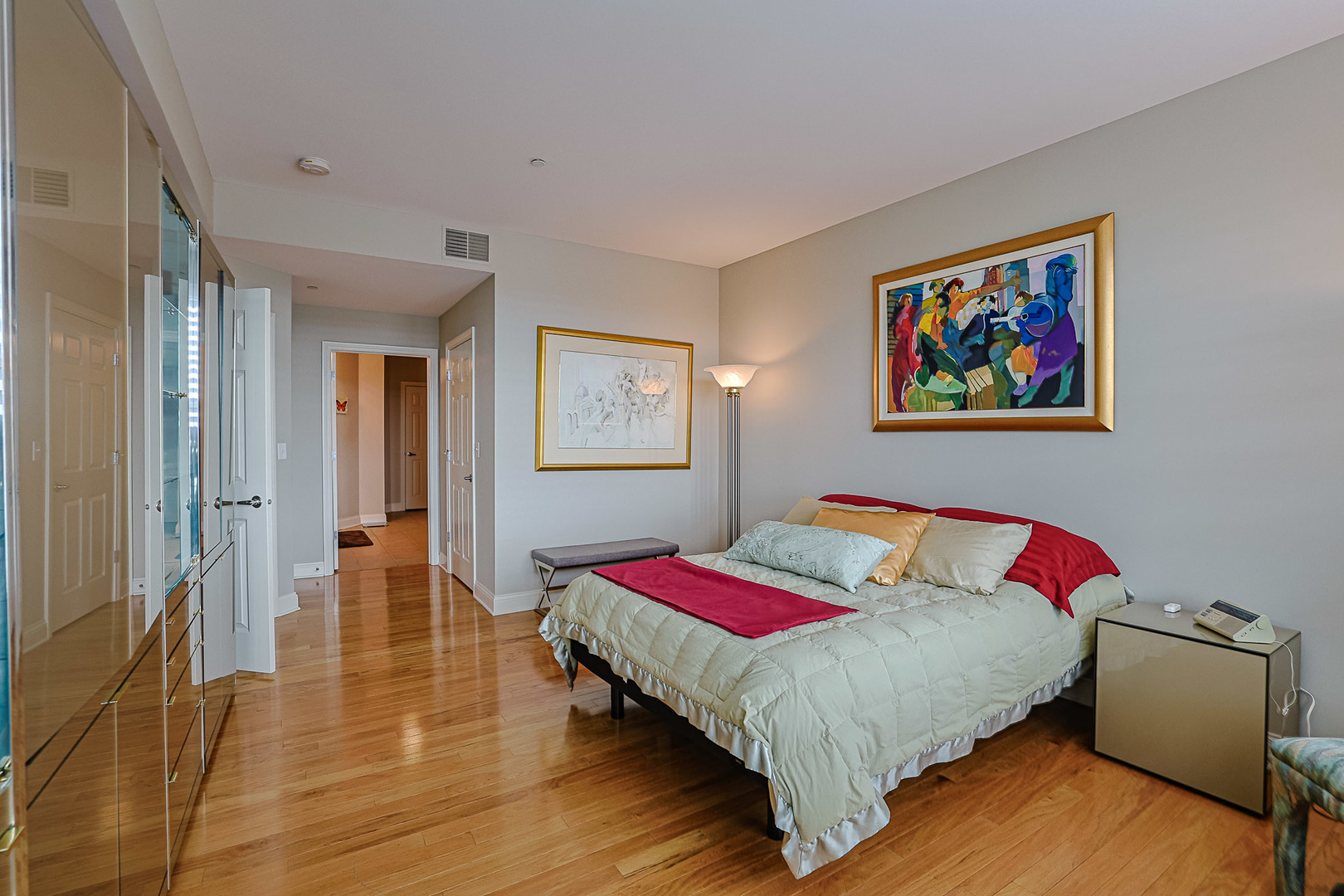 2700 Summit Drive, Unit 401 Glenview, IL 60025 - Photo 16 of 31 a bedroom with a bed and a painting on the wall