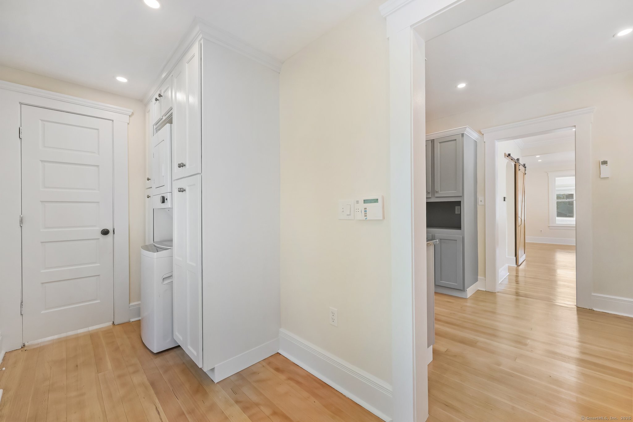 366 Suburban Avenue Fairfield, CT 06825 - Photo 12 of 34 a view of a hallway with wooden floor