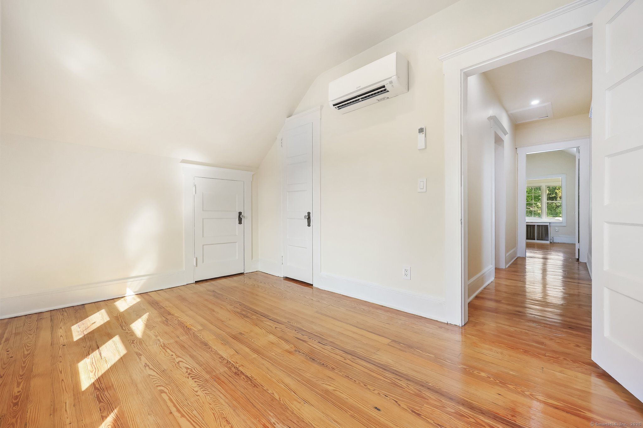 366 Suburban Avenue Fairfield, CT 06825 - Photo 16 of 34 wooden floor in an empty room