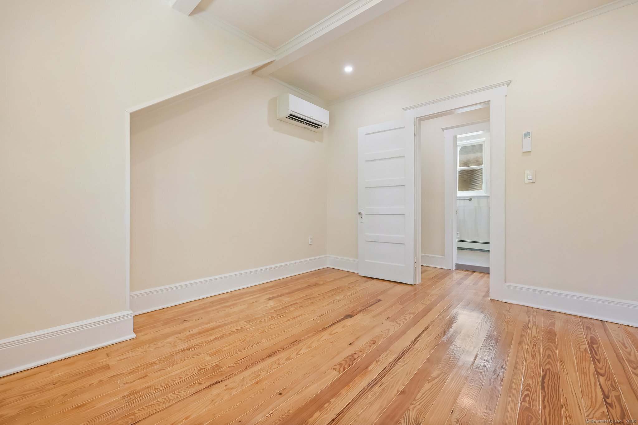 366 Suburban Avenue Fairfield, CT 06825 - Photo 18 of 34 an empty room with wooden floor and closet