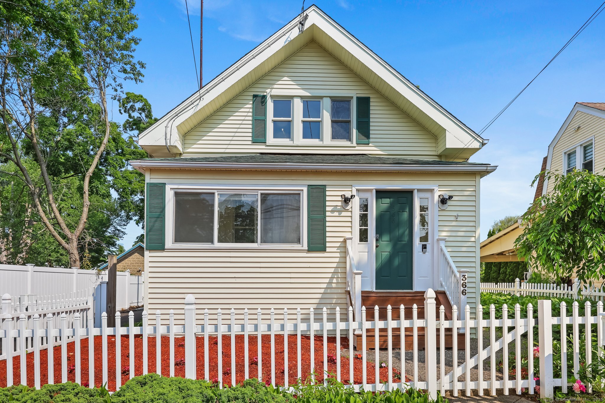 366 Suburban Avenue Fairfield, CT 06825 - Photo 2 of 34 a front view of a house with a yard