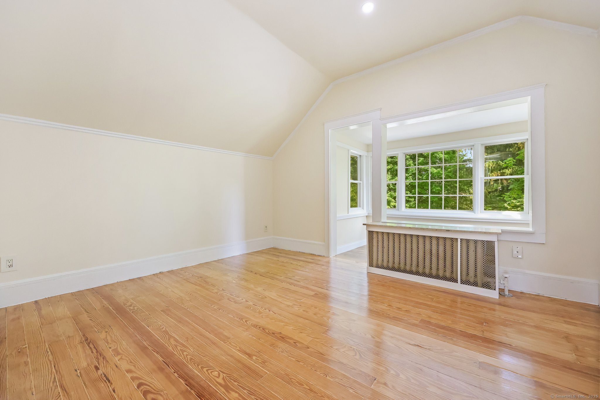 366 Suburban Avenue Fairfield, CT 06825 - Photo 21 of 34 an empty room with wooden floor and windows