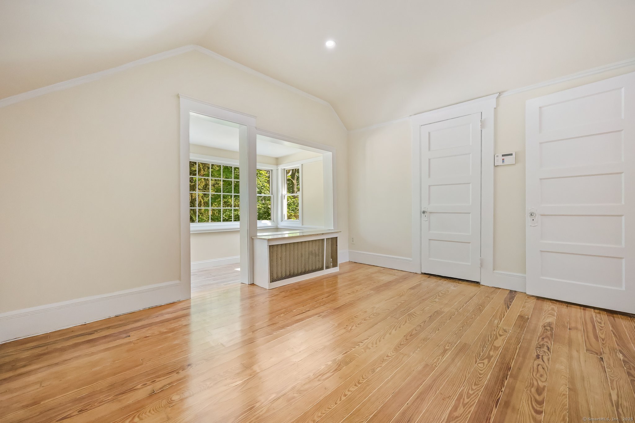 366 Suburban Avenue Fairfield, CT 06825 - Photo 23 of 34 wooden floor in an empty room with a window