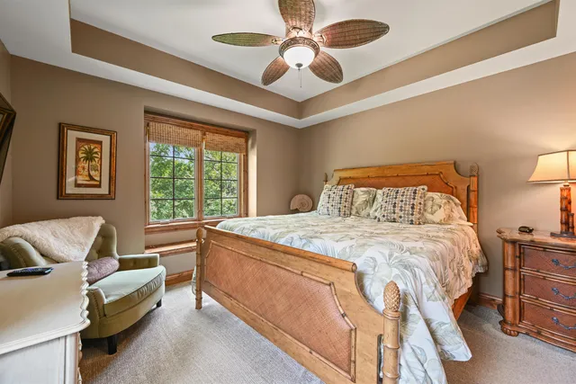 a bedroom with a bed couch and window