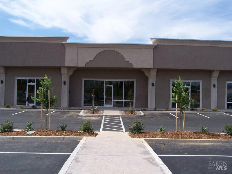 2650 Larkspur Lane, Unit F Redding, CA 96002 - Photo 2 of 5 a front view of a house with sitting area