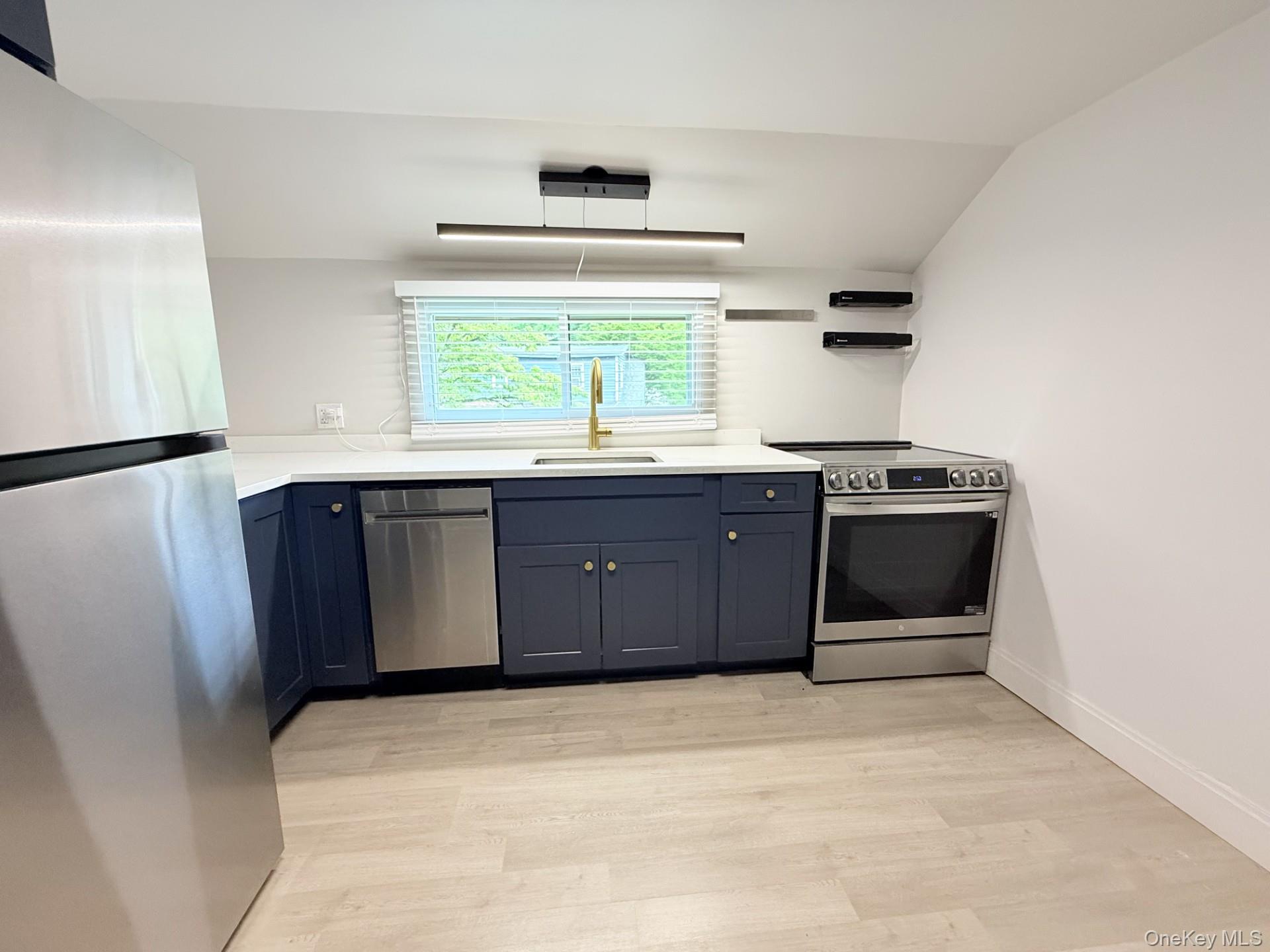 4 Lower Trinity Pass Road Pound Ridge, NY 10576 - Photo 20 of 29 a kitchen with stainless steel appliances granite countertop a stove a sink and a refrigerator