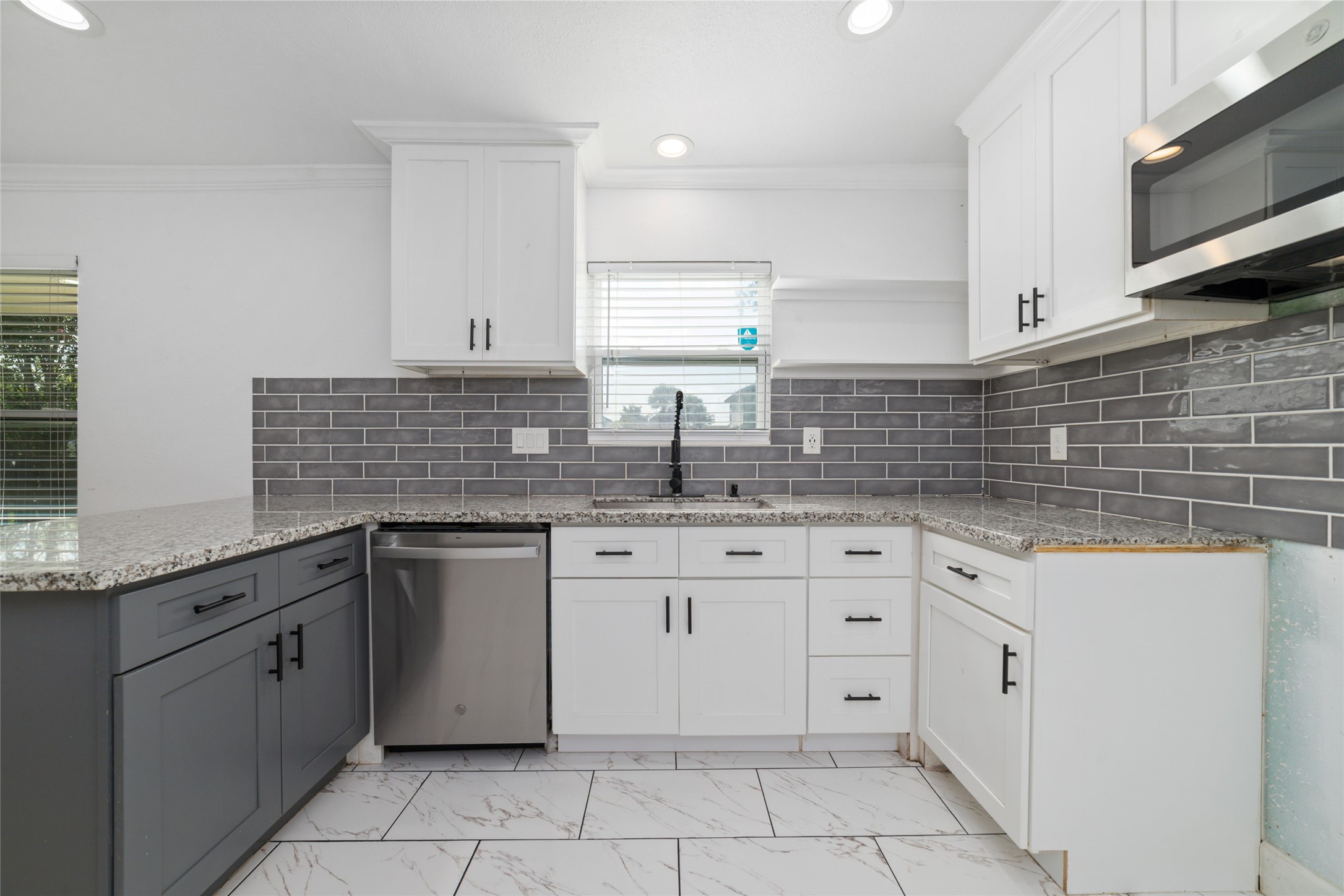 7125 Conley Street Houston, TX 77021 - Photo 6 of 32 Modern kitchen with plenty of counter space and cabinets and recessed lighting.