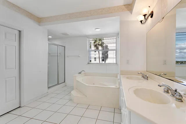 a spacious bathroom with a bathtub and sink