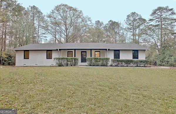 a front view of a house with yard