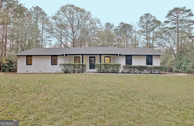 a front view of a house with yard