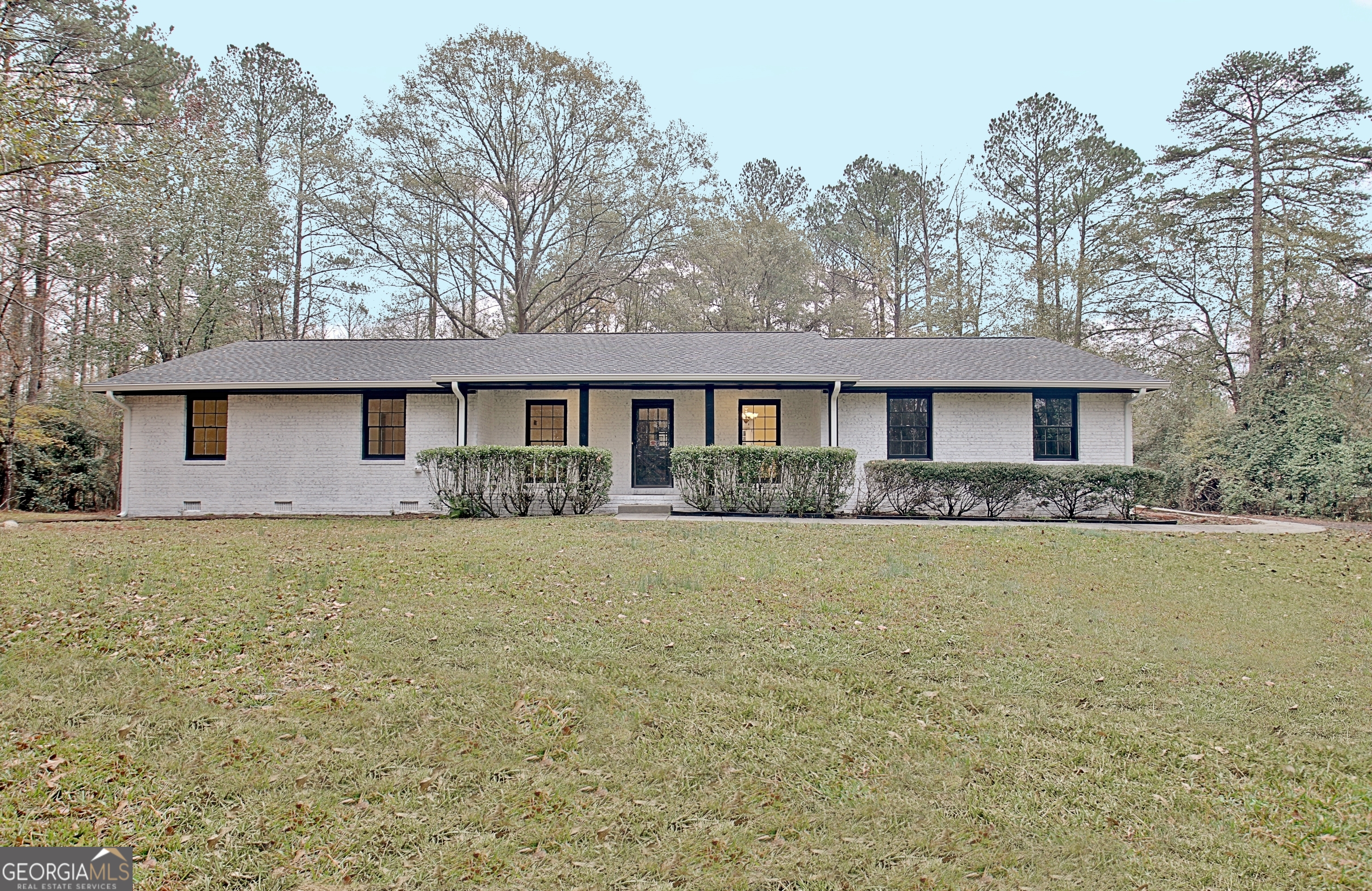 a front view of a house with yard