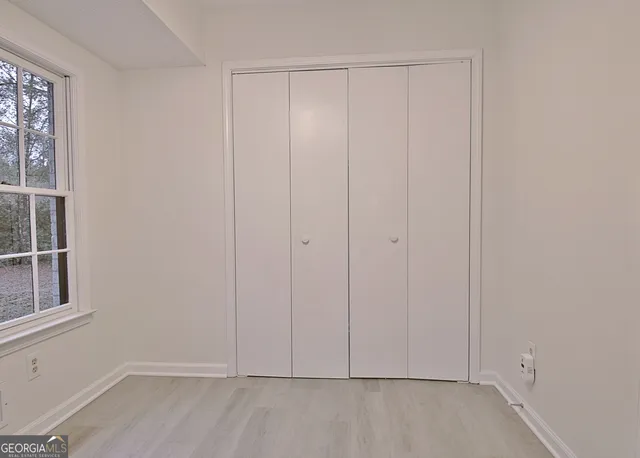 a view of cabinets and window