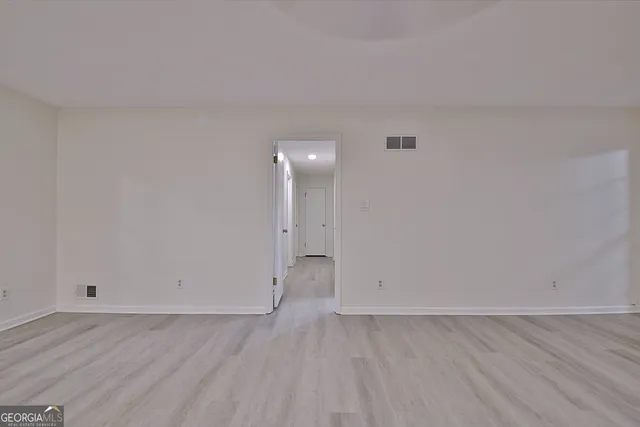 a bedroom with bed and a window